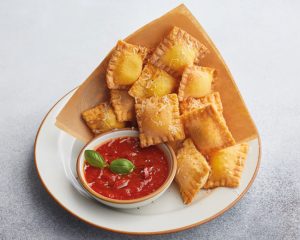 A plate of crispy Ravioli Fritti with tomato sauce from Jamie's Italian Restaurant