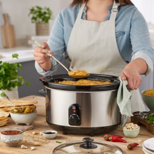 A woman prepares food using Lakeland tools