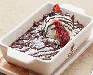 Molten Lava Cake with Ice cream Scoop with Chocolate sauce & strawberry from Molten Chocolate Café