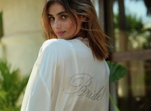 A woman wearing a Victoria's Secret bridal robe