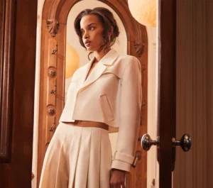 A model wearing an off-white suit from BCBGMAXAZRIA