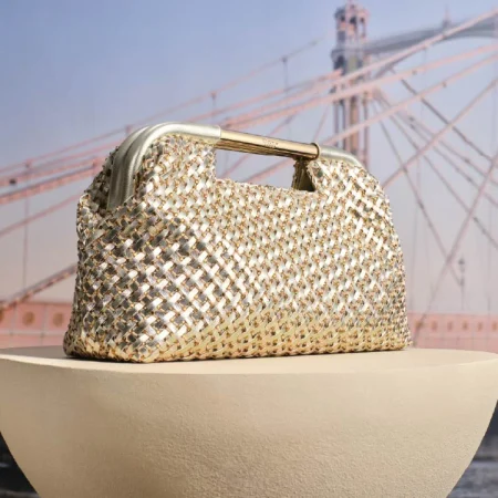 DUNE LONDON EXPRESSION: Elegant occasion bag with gold bar handle & diamante mesh weave—subtle shimmer, magnetic closure, and optional chain strap for versatile styling.
